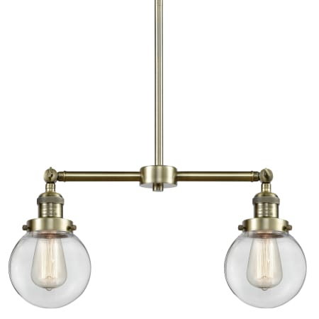 A large image of the Innovations Lighting 209-6 Beacon Antique Brass / Clear