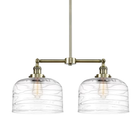 A large image of the Innovations Lighting 209-10-21-L Bell Linear Antique Brass / Clear Deco Swirl