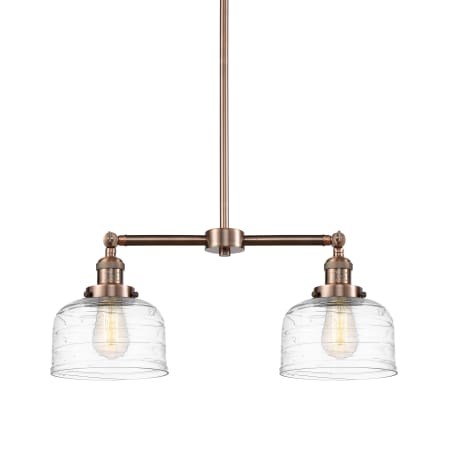 A large image of the Innovations Lighting 209-10-21 Bell Linear Antique Copper / Clear Deco Swirl