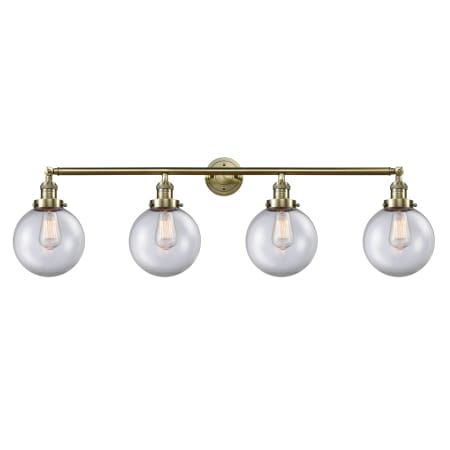 A large image of the Innovations Lighting 215-14-44 Beacon Vanity Antique Brass / Clear