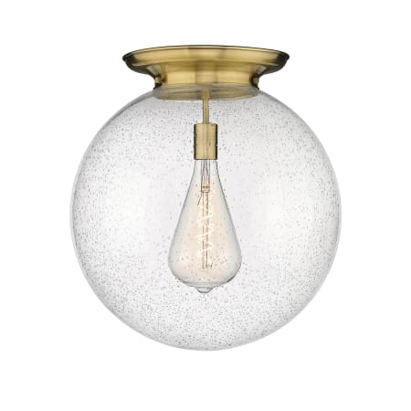 A large image of the Innovations Lighting 221-1F-20-18 Beacon Flush Antique Brass / Seedy
