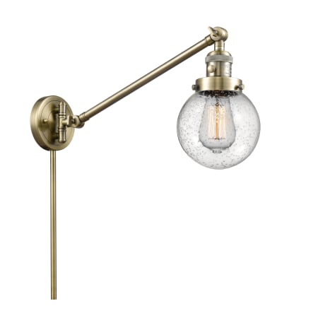 A large image of the Innovations Lighting 237-6 Beacon Antique Brass / Seedy