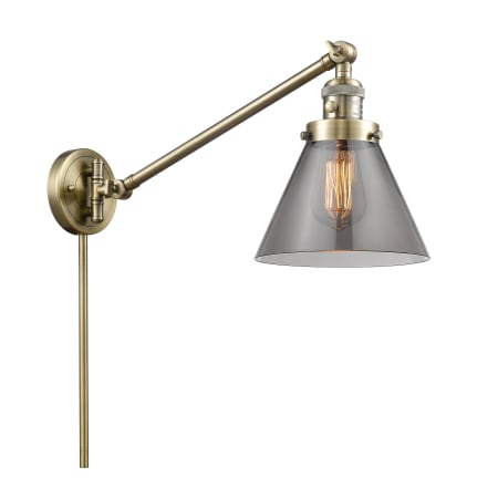 A large image of the Innovations Lighting 237 Large Cone Antique Brass / Plated Smoke