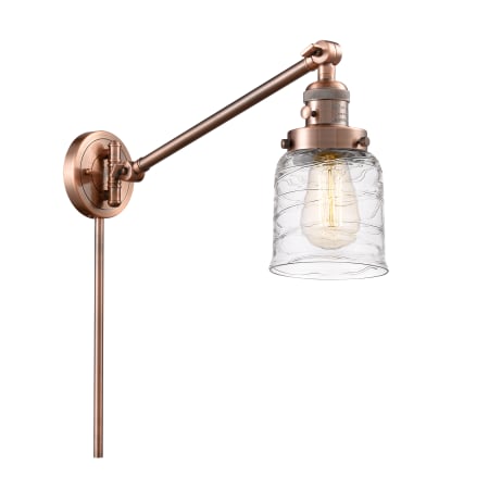 A large image of the Innovations Lighting 237-25-8 Bell Sconce Antique Copper / Deco Swirl