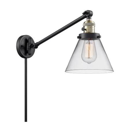 A large image of the Innovations Lighting 237 Large Cone Black / Antique Brass / Clear