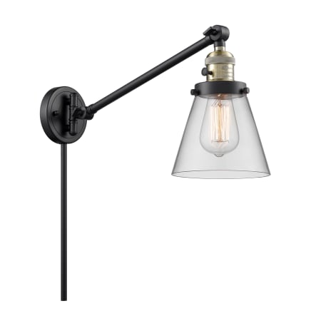 A large image of the Innovations Lighting 237 Small Cone Black / Antique Brass / Clear