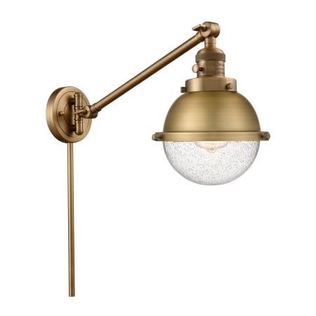 A large image of the Innovations Lighting 237-11-7 Hampden Sconce Brushed Brass / Seedy