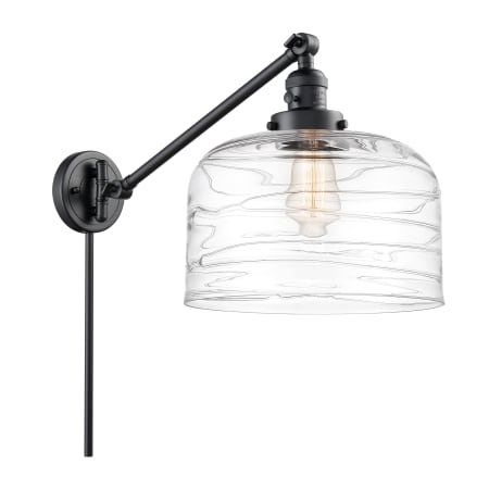 A large image of the Innovations Lighting 237--13-12-L Bell Sconce Matte Black / Clear Deco Swirl