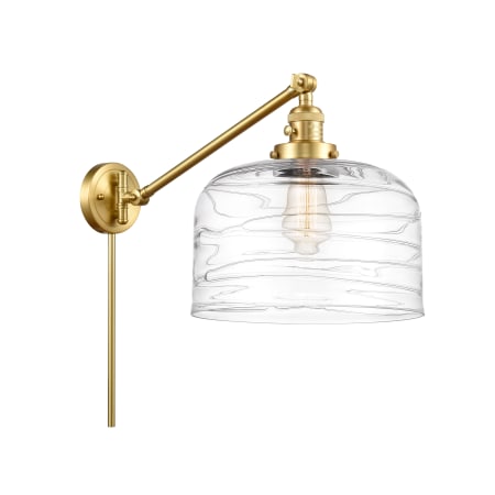A large image of the Innovations Lighting 237-13-12-L Bell Sconce Satin Gold / Clear Deco Swirl