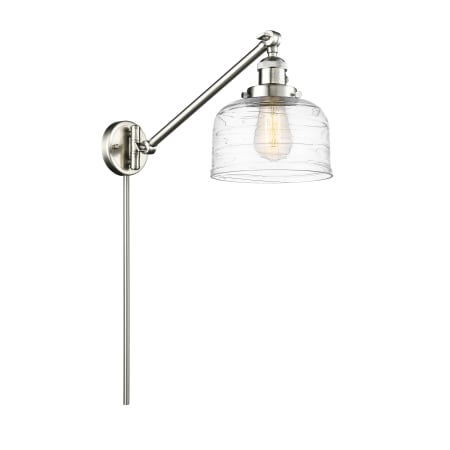 A large image of the Innovations Lighting 237-25-8 Bell Sconce Brushed Satin Nickel / Clear Deco Swirl