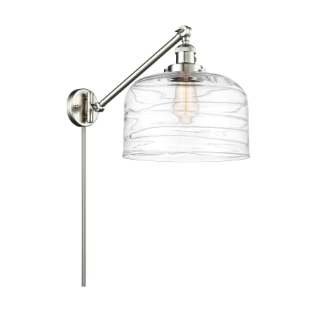A large image of the Innovations Lighting 237--13-12-L Bell Sconce Brushed Satin Nickel / Clear Deco Swirl