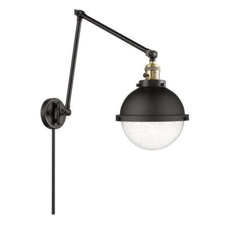A large image of the Innovations Lighting 238-14-9 Hampden Sconce Black Antique Brass / Seedy