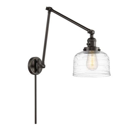 A large image of the Innovations Lighting 238-30-8 Bell Sconce Oil Rubbed Bronze / Clear Deco Swirl