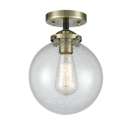 A large image of the Innovations Lighting 284-1C-8 Beacon Black Antique Brass / Seedy