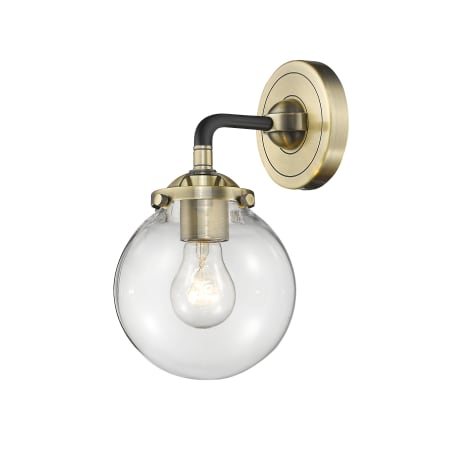 A large image of the Innovations Lighting 284-1W-6 Beacon Black Antique Brass / Clear