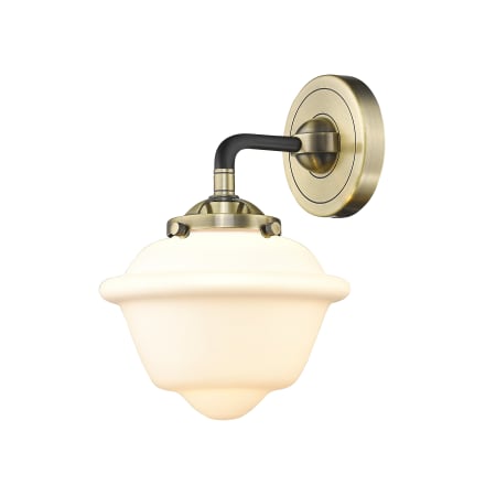 A large image of the Innovations Lighting 284-1W Small Oxford Black Antique Brass / Matte White Cased