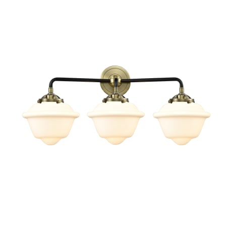 A large image of the Innovations Lighting 284-3W Small Oxford Black Antique Brass / Matte White Cased