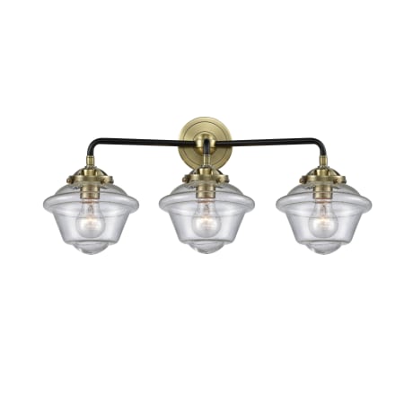 A large image of the Innovations Lighting 284-3W Small Oxford Black Antique Brass / Seedy