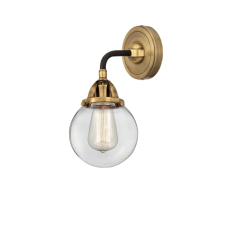 A large image of the Innovations Lighting 288-1W-10-6 Beacon Sconce Black Antique Brass / Clear