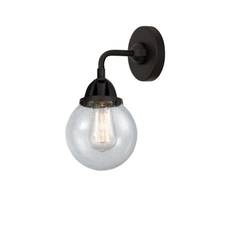 A large image of the Innovations Lighting 288-1W-10-6 Beacon Sconce Matte Black / Seedy