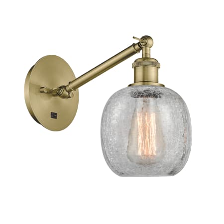 A large image of the Innovations Lighting 317-1W-13-6 Belfast Sconce Antique Brass / Clear Crackle
