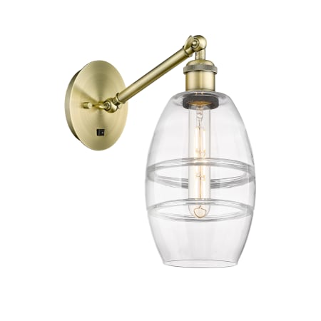 A large image of the Innovations Lighting 317-1W-8-6 Vaz Sconce Antique Brass / Clear