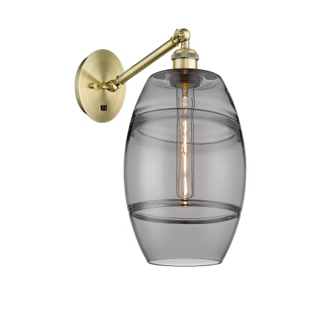 A large image of the Innovations Lighting 317-1W-10-8 Vaz Sconce Antique Brass / Smoked