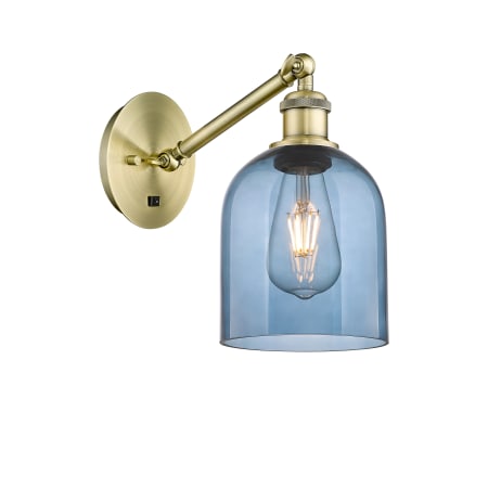 A large image of the Innovations Lighting 317-1W-10-6 Bella Sconce Antique Brass / Princess Blue