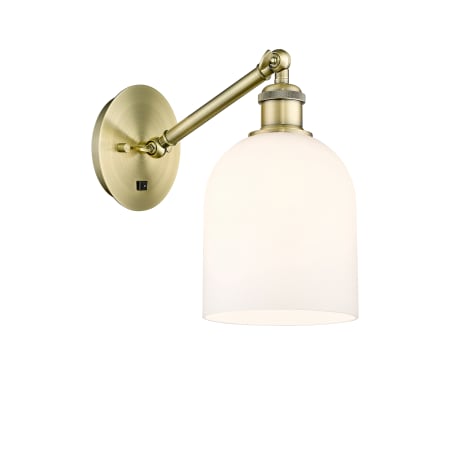 A large image of the Innovations Lighting 317-1W-10-6 Bella Sconce Antique Brass / Gloss White