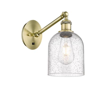 A large image of the Innovations Lighting 317-1W-10-6 Bella Sconce Antique Brass / Seedy