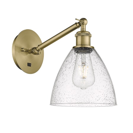 A large image of the Innovations Lighting 317-1W-14-8 Bristol Sconce Antique Brass / Seedy