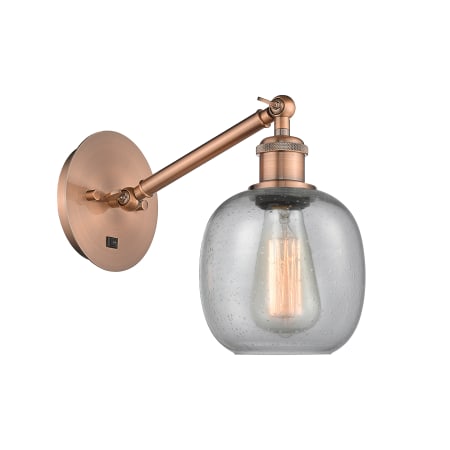 A large image of the Innovations Lighting 317-1W-13-6 Belfast Sconce Antique Copper / Seedy