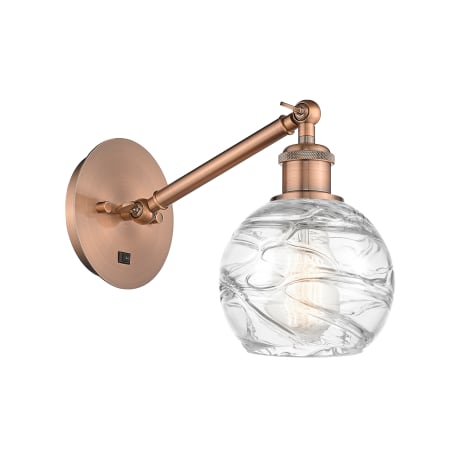 A large image of the Innovations Lighting 317-1W-12-6 Athens Sconce Antique Copper / Clear Deco Swirl