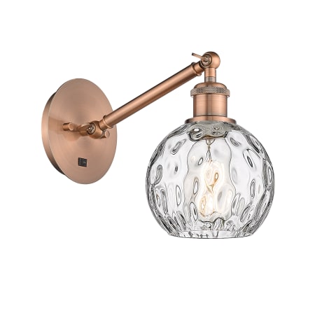 A large image of the Innovations Lighting 317-1W-12-6 Athens Sconce Antique Copper / Clear Water Glass