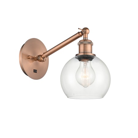 A large image of the Innovations Lighting 317-1W-12-6 Athens Sconce Antique Copper / Clear