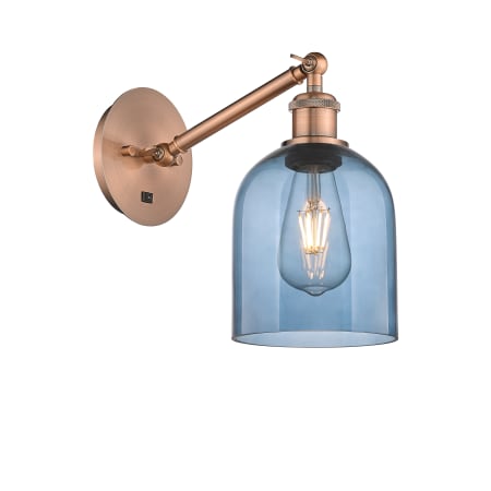 A large image of the Innovations Lighting 317-1W-10-6 Bella Sconce Antique Copper / Princess Blue