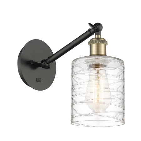 A large image of the Innovations Lighting 317-1W-13-6 Cobbleskill Sconce Black Antique Brass / Deco Swirl