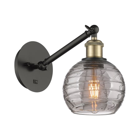 A large image of the Innovations Lighting 317-1W 8 6 Athens Deco Swirl Sconce Black Antique Brass / Light Smoke Deco Swirl