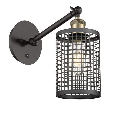 A large image of the Innovations Lighting 317-1W-12-5 Nestbrook Sconce Black Antique Brass / Matte Black