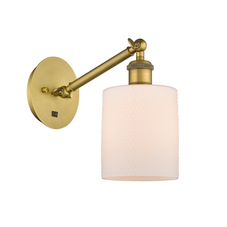 A large image of the Innovations Lighting 317-1W-13-5 Cobbleskill Sconce Brushed Brass / Matte White