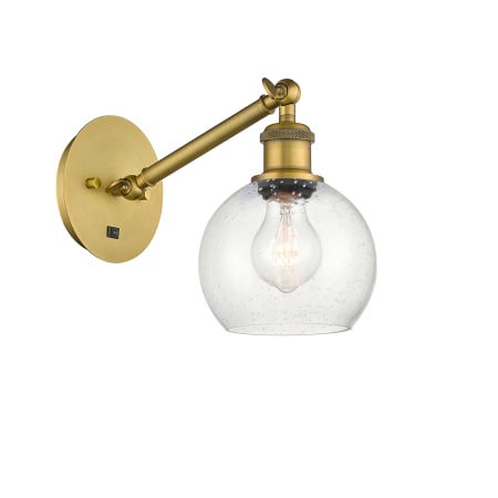 A large image of the Innovations Lighting 317-1W-12-6 Athens Sconce Brushed Brass / Seedy