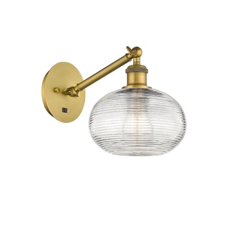 A large image of the Innovations Lighting 317-1W-9-8 Ithaca Sconce Brushed Brass / Clear Ithaca