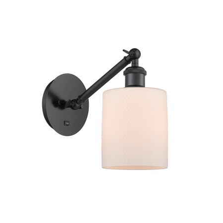 A large image of the Innovations Lighting 317-1W-13-5 Cobbleskill Sconce Matte Black / Matte White