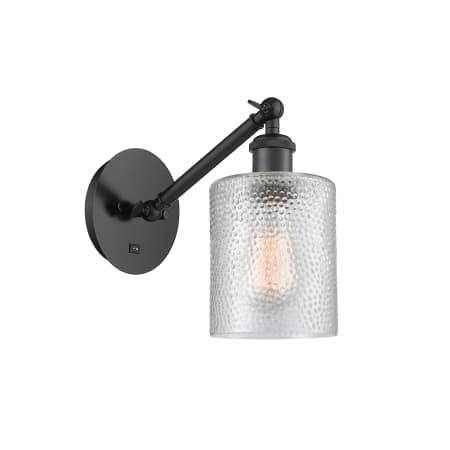 A large image of the Innovations Lighting 317-1W-13-5 Cobbleskill Sconce Matte Black / Clear