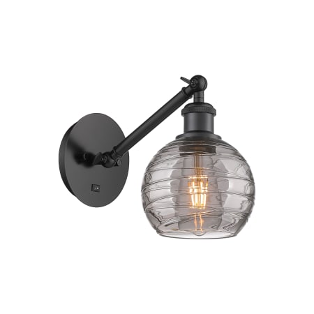 A large image of the Innovations Lighting 317-1W 8 6 Athens Deco Swirl Sconce Matte Black / Light Smoke Deco Swirl