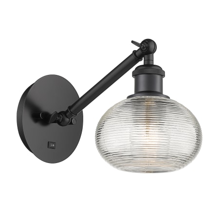 A large image of the Innovations Lighting 317-1W-7-6 Ithaca Sconce Matte Black / Clear Ithaca