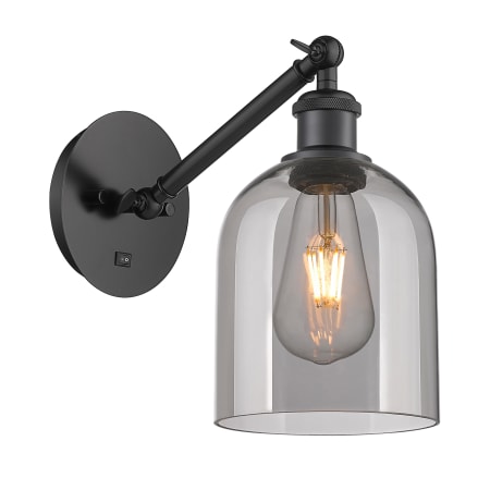 A large image of the Innovations Lighting 317-1W-10-6 Bella Sconce Matte Black / Light Smoke