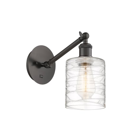 A large image of the Innovations Lighting 317-1W-13-5 Cobbleskill Sconce Oil Rubbed Bronze / Deco Swirl