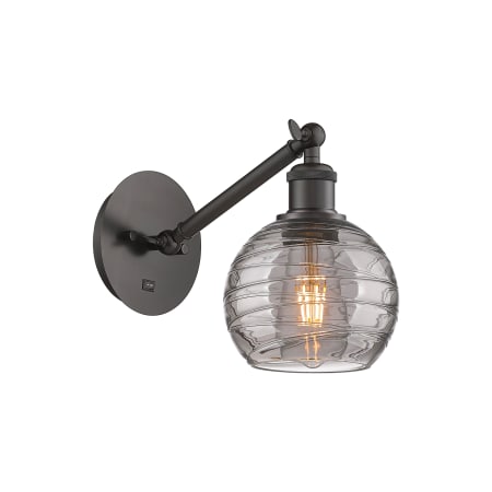 A large image of the Innovations Lighting 317-1W 8 6 Athens Deco Swirl Sconce Oil Rubbed Bronze / Light Smoke Deco Swirl