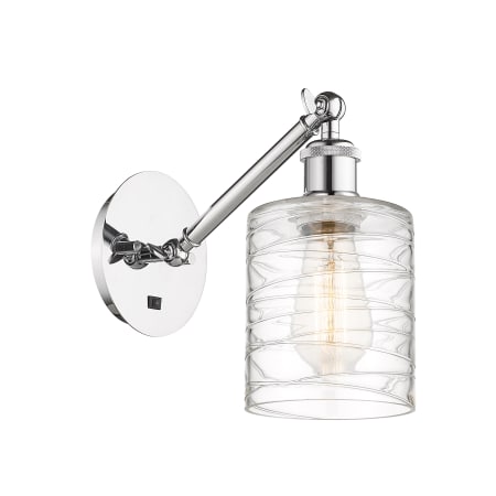 A large image of the Innovations Lighting 317-1W-13-5 Cobbleskill Sconce Polished Chrome / Deco Swirl